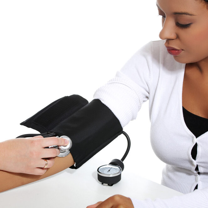 Doctor checking blood pressure of pregnant woman, isolated on white background